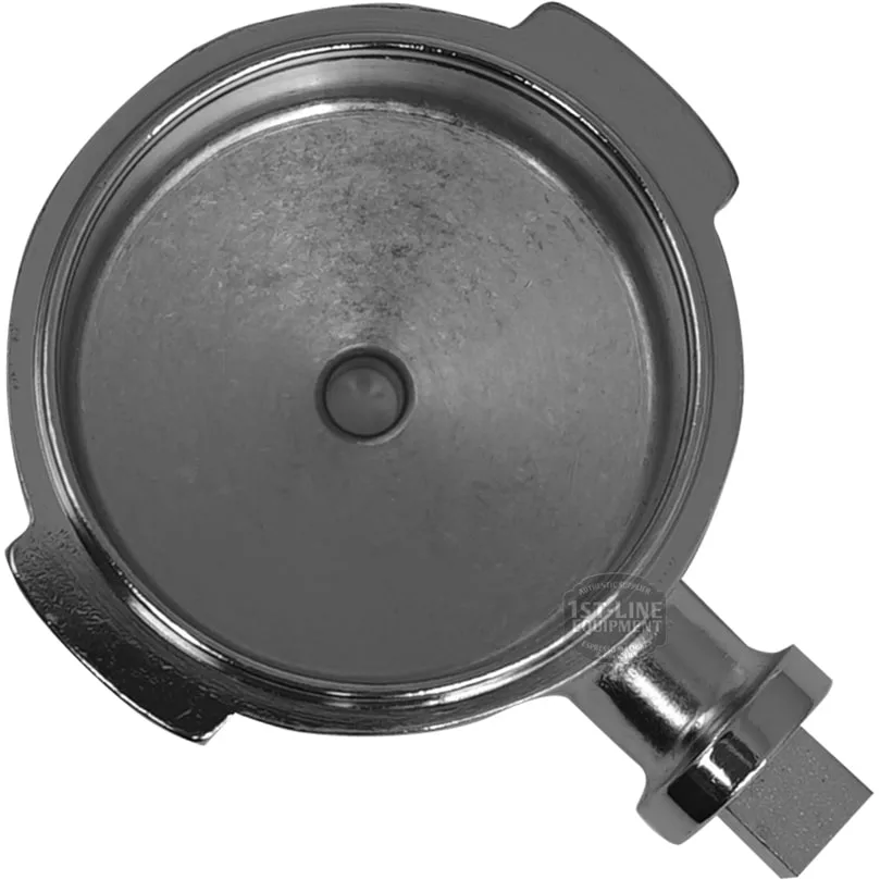 A top-down view of the Futurmat NEW ARIETE FILTERHOLDER BODY portafilter basket, featuring a single central hole and two metal notches on the rim, designed for use in compatible espresso machines. © 2025 1st-line.com