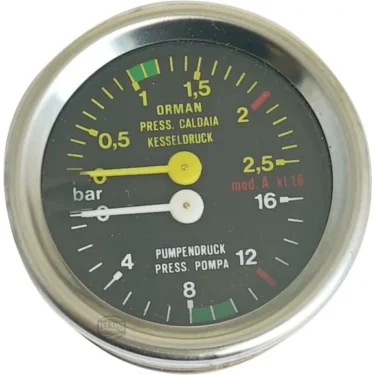 The Wega DOUBLE MANOMETER is a round gauge with a black face, yellow and white needles, and colored scale markings from 0–4 bar. Its dial includes Italian and German labels, with zones in green, yellow, white, and red. © 2025 1st-line.com