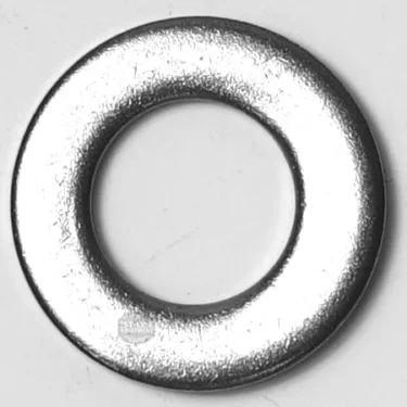 A close-up image of a metallic flat washer with a central hole, placed on a plain background, typically used with the SP.338 HANDLE SEEGER in mechanical assemblies. © 2025 1st-line.com