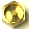 A close-up of the CA.221 GASKET HOLDER, a brass hexagonal screw cap with a raised circular center and shiny metallic finish, shown on a light background. © 2025 1st-line.com