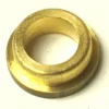 A close-up of the F..330 SPRING BUSHING, a small round brass spacer with a central hole, shown on a light background. © 2025 1st-line.com