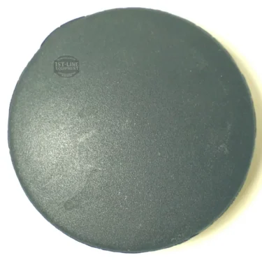 A close-up photo of the P..227 HOLDER HANDLE CAP, a round, flat piece with a matte black surface, shown on a white background. © 2025 1st-line.com