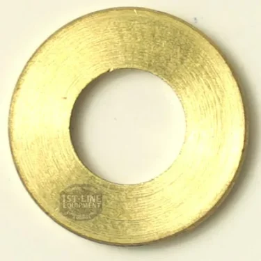 A round brass washer with a large center hole, smooth finish, and 1st-Line Equipment mark—perfect for use with the GAGGIA 145°C STEAM THERMOSTAT assembly. © 2025 1st-line.com