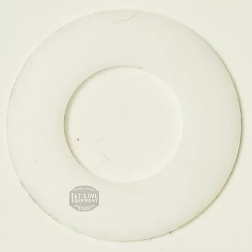 A white, round R..613 PTFE Washer (18x9x0.5 mm) with a central hole and faint scratches is shown from above on a light background, featuring a small 1st-Line Equipment logo. © 2025 1st-line.com
