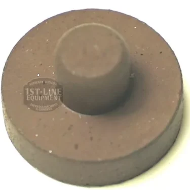 The F.1734 VITON CLOSING GASKET is a round, brown, flat disc with a raised center, made of durable VITON and often used as a closing gasket, shown against a white background. © 2025 1st-line.com