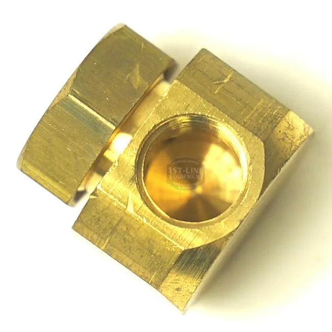 The V..872 1/8F 90º Fitting for Ulka Vibrator Pump features a brass hexagonal body with a central 1/8F threaded hole and a large hex nut on one side, viewed from an angled top-down perspective—perfect for Ulka connections. © 2025 1st-line.com