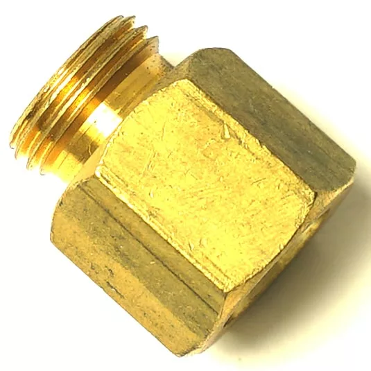 A brass hexagonal nut with a threaded male fitting and an SM.182 ALIMENTARY GASKET 51x19x1 mm are shown in close-up against a white background. © 2025 1st-line.com