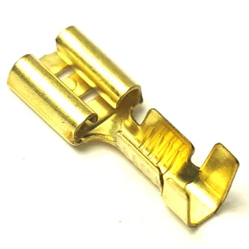 A close-up of a gold-colored V..559 MALE FAXTON TERMINAL crimp connector, commonly used for electrical wiring and connections. © 2025 1st-line.com