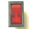 A close-up of a rectangular red rocker switch with a black plastic frame, shown from above with its ridged surface in the off position, placed next to a V.4279 YELLOW LIGHT PUSH-BUTTON for enhanced functionality. © 2025 1st-line.com