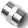 A close-up of a shiny V.1612 1/2fX1/2f metal pipe coupling with a hexagonal center, designed for joining two pipes in plumbing or industrial systems. © 2025 1st-line.com