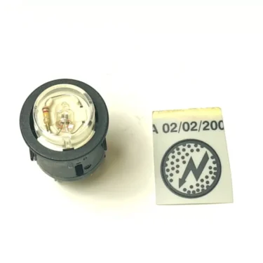 A close-up of a V.4252 25mm Reset Switch shows visible wiring and a separate rectangular label with a lightning bolt symbol and the date 02/02/2000. © 2025 1st-line.com