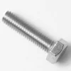 A close-up of a V..937 M6X10mm stainless steel screw on a white surface, highlighting its threaded shaft and hexagonal head. © 2025 1st-line.com
