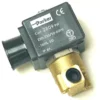 A close-up of the F.1708 1/8X1/8 2WAYS Parker solenoid valve, 9W, shows its black coil on a brass body with certification symbols marked on the component. © 2025 1st-line.com
