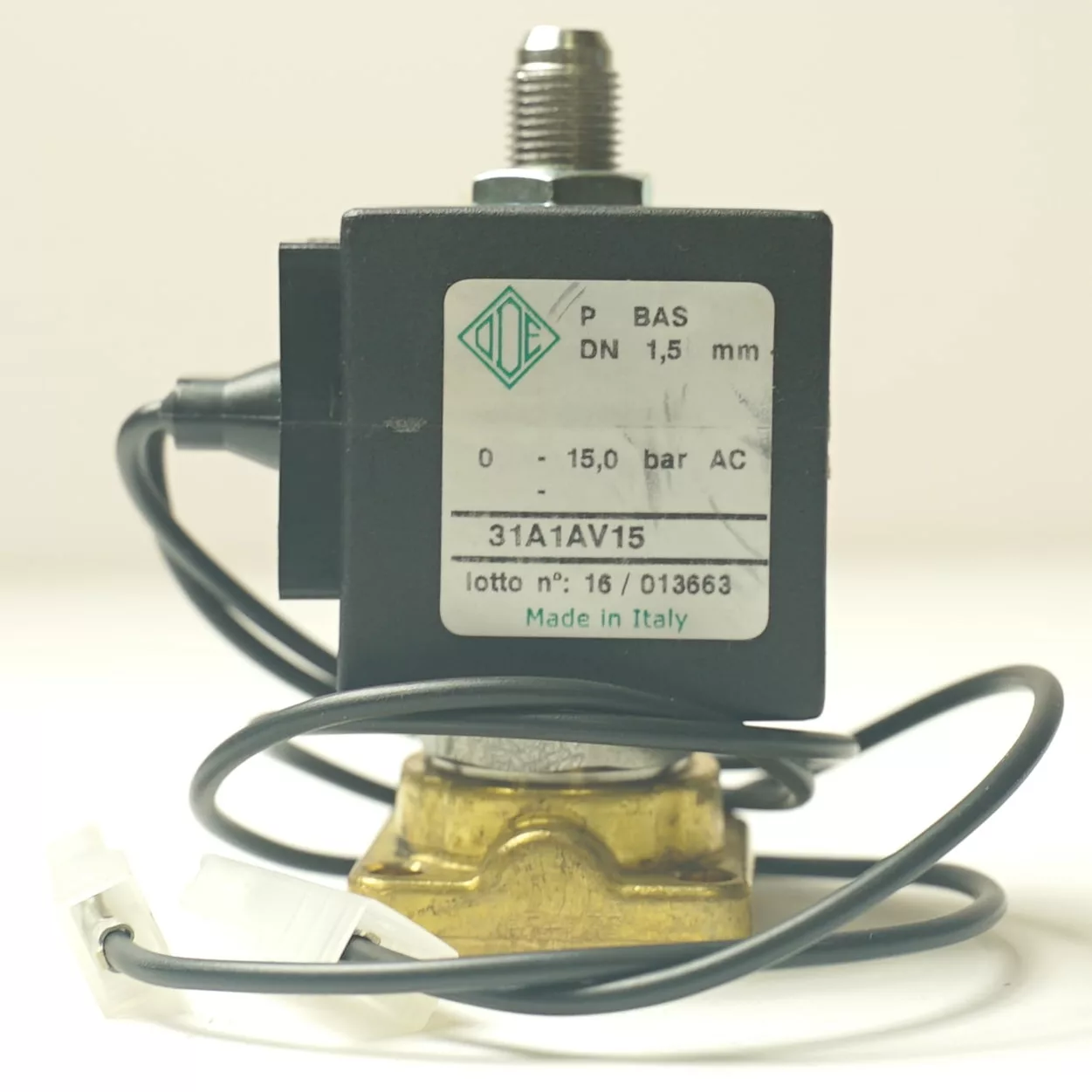 A close-up of the LB..55 220V RED WARNING LAMP shows its technical label, black coil, metal fitting, brass base, and attached wires against a plain white background. Made in Italy. © 2025 1st-line.com