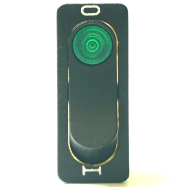 A close-up of the OW...1 On-Off Switch 34x11mm, featuring a circular green indicator at the top, mounted vertically on a rectangular black plate. © 2025 1st-line.com