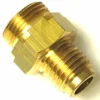 A close-up of the R..110 TAP FITTING, made of brass with external threads on both ends and a hexagonal center for wrench tightening, suitable for connecting two pipes or hoses. © 2025 1st-line.com
