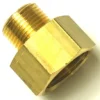 A close-up of the V.1603 1/2x1 FITTING adapter with a male threaded end and a larger hexagonal female threaded end, shown on a white background. © 2025 1st-line.com