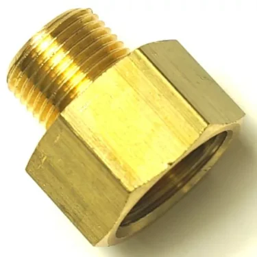 A close-up of the V.1603 1/2x1 FITTING adapter with a male threaded end and a larger hexagonal female threaded end, shown on a white background. © 2025 1st-line.com
