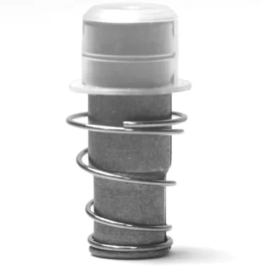 A close-up of the V.1651 3 WAYS (TYPE 7W) M&M SOLENOID CORE—a small metal cylinder with a solenoid core, silver coil spring, and translucent plastic cap—set against a white background. © 2025 1st-line.com