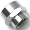 A close-up of the V.1874 3/8Fx1/2F FITTING hex nut with a flared base, featuring a shiny, smooth metallic finish and reflective surface against a white background. © 2025 1st-line.com
