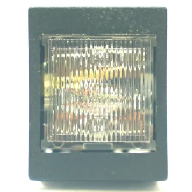 A close-up of the V.4266 27.2x22.2mm LIGHT PUSH-BUTTON, a square, ribbed, clear plastic indicator light in a black rectangular frame, shown against a white background. © 2025 1st-line.com