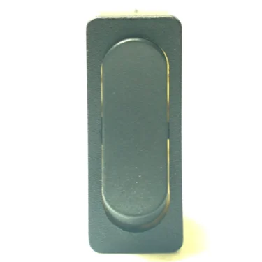 A close-up of the V.4356 GREEN LIGHT ROCKER SWITCH, black and rectangular with a green light and rounded center, shown in the neutral position against a white background. © 2025 1st-line.com
