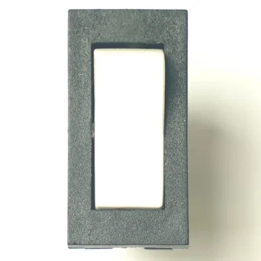 A close-up photo of a black rectangular V.4343 WHITE ROCKER SWITCH positioned vertically against a white background. © 2025 1st-line.com