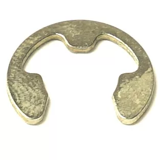 A metallic E-clip retaining ring with a semicircular shape and three inner notches is often paired with the SM.473 PTFE GASKET to secure components on a shaft. © 2025 1st-line.com