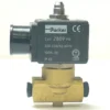 A PARKER SOLENOID valve, model V.1456 230V 3W 1/8x1/8, features a black “ZB09” coil and is mounted on a brass two-port valve body with an electrical connector. © 2025 1st-line.com