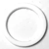 A Pavoni P..327 PTFE HEATING ELEMENT GASKET 52x41x2mm, white and circular with a smooth, solid finish, lies flat on a white surface, its inner edge casting a soft shadow. The design is simple and unadorned. © 2025 1st-line.com