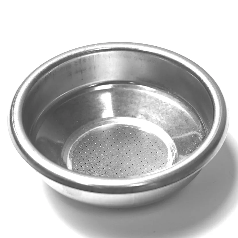 A small, round stainless steel M...67 1 CUP DIAMETER 66mm FILTER basket with a perforated bottom, used in espresso machines as a coffee filter, sits on a white surface. © 2025 1st-line.com