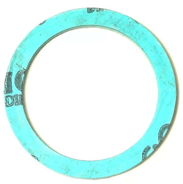 A turquoise-blue circular gasket with black text is placed beside the SM.196 GREY GOLDEN TAP HANDLE, both shown on a white background. © 2025 1st-line.com