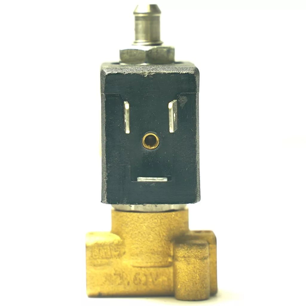 A V.1696 600mm TOUCHPAD RIBBON WIRING solenoid valve, featuring brass and black components, stands upright against a white background. The front shows two metal prongs and a hole on the black part, resembling a face. © 2025 1st-line.com