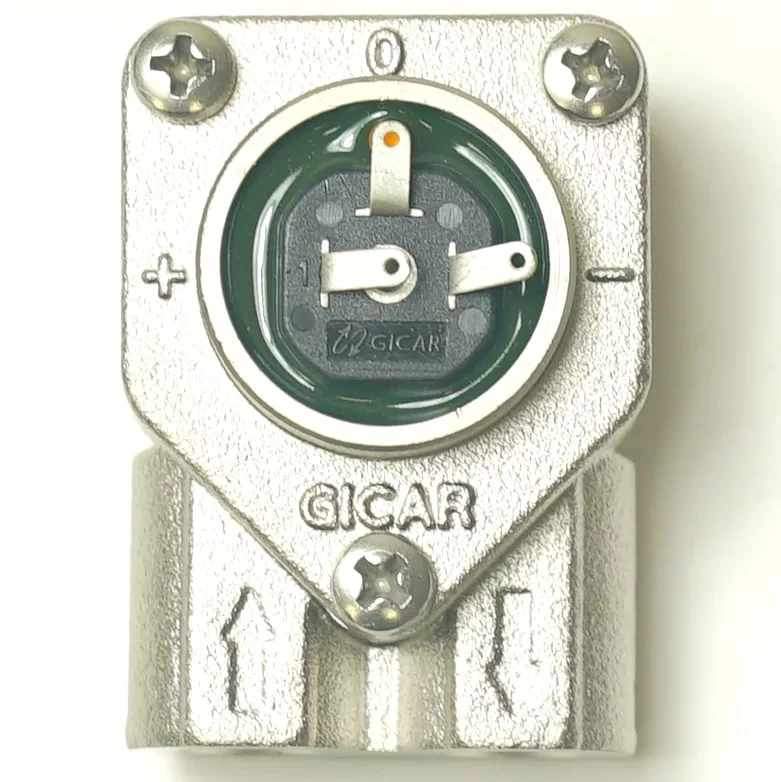Close-up of a metallic GICAR V.1437 1/8 3 CONNECTIONS FLOWMETER with a round green and black dial, plus/minus symbols, screws at the corners, and arrows pointing downwards. © 2025 1st-line.com