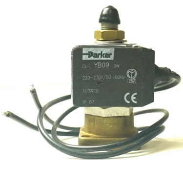 Close-up of a Parker YB09 solenoid valve with black coil, two exposed wires, and technical specs—including voltage, frequency, IP67 rating—often paired with a DISCONTINUED MAGISTER 230V CONTACTOR. © 2025 1st-line.com