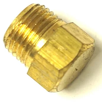 Close-up of a shiny, unused brass hex head plug with male threads, angled on a white background. Designed for use with the R..462 PTFE HEATING ELEMENT GASKET 65x46x1.5mm. © 2025 1st-line.com