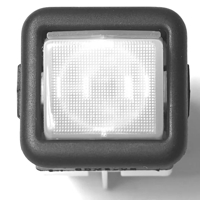 Close-up of a V.4401 MOMENTARY ROCKER SWITCH - CLEAR, square with a textured white surface and black border, viewed from above against a plain white background. © 2025 1st-line.com