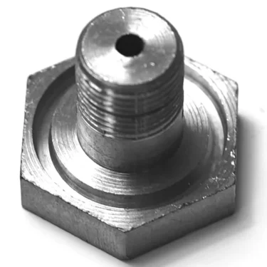 Close-up of an MZ...7 SCREW hex bolt featuring a threaded shaft and a central hole through the top, placed on a white background. © 2025 1st-line.com