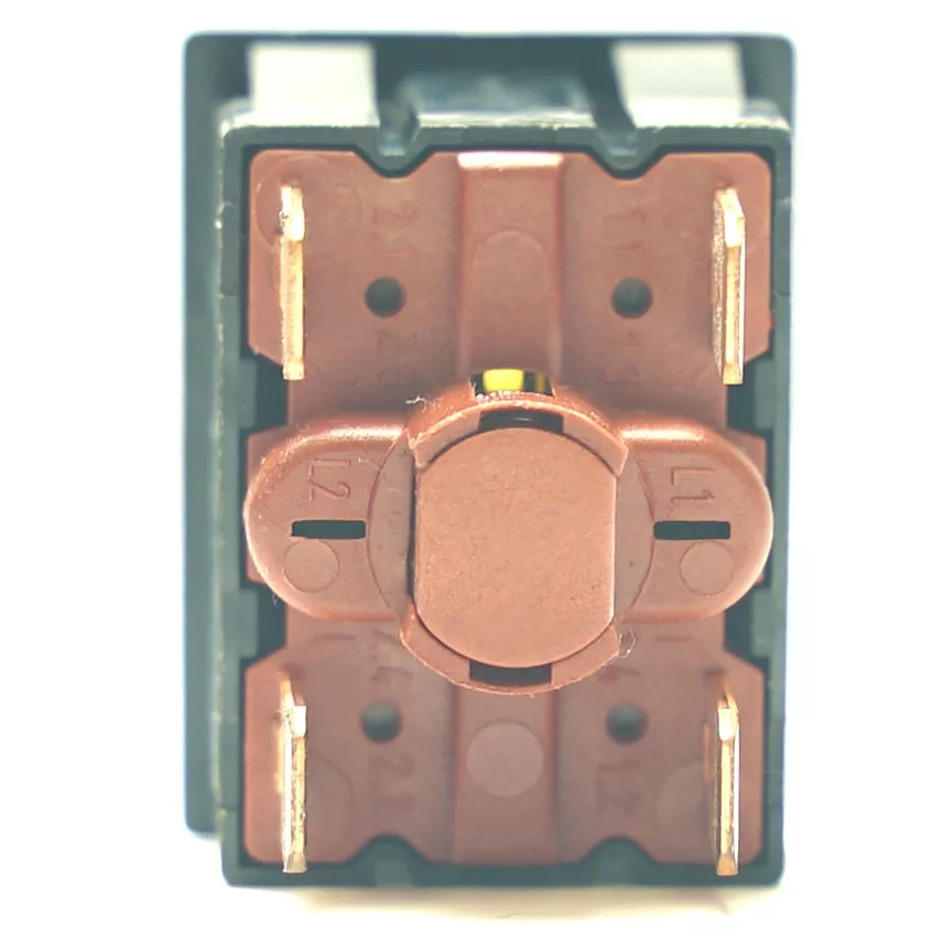 Close-up of the underside of the V.4286 YELLOW PUSH-BUTTON switch, featuring four metal terminals and a central circular brown plastic part against a white background, with the yellow push-button partially visible on one side. © 2025 1st-line.com