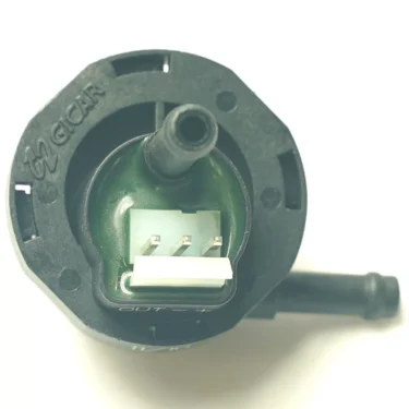 Close-up of the V.4239 PUSH SWITCH - GREY, a black plastic automotive sensor with OUT and GCAR labels, two hose outlets, a three-pin white connector, and an integrated grey push switch for easy operation. © 2025 1st-line.com