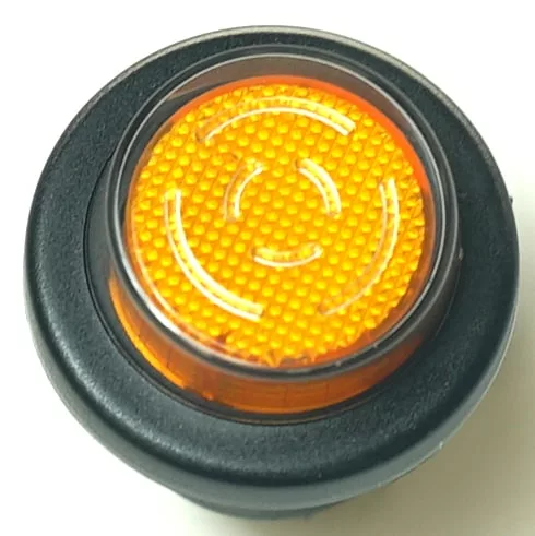 Close-up of the V.4244 25mm DIAMETER FAN SWITCH: features a round orange indicator light with a textured surface, white concentric markings, and black housing—perfect for fan switch or V.4244 panel applications. © 2025 1st-line.com