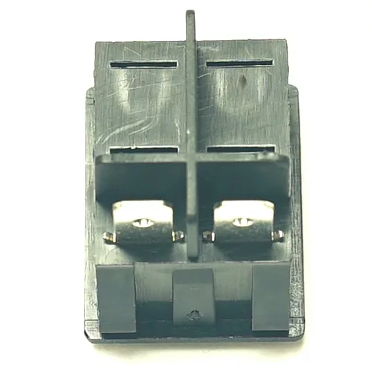 Close-up of the V.4308 WHITE INDICATOR LIGHT 230V, featuring a black plastic connector with two metal terminals separated by a vertical divider, designed for 230V use, shown against a white background. © 2025 1st-line.com