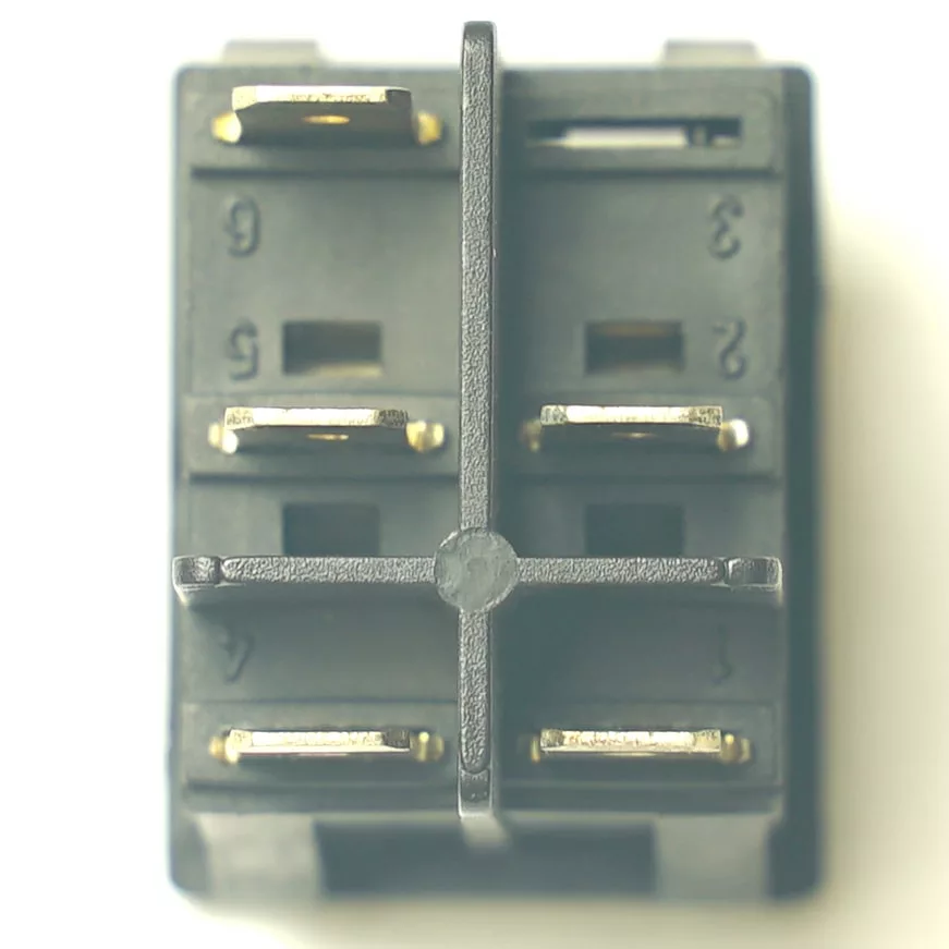 Close-up view of a V.4387 DOUBLE ROCKER SWITCH - ORANGE/ORANGE, rectangular with 6 pins, metallic gold contacts, and numbered slots, shown from above on a plain light background. © 2025 1st-line.com