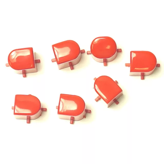 Seven red LEGO bricks with curved tops and side connectors, arranged on white, mirror the precise design and uniformity of the SM.281 PTFE HEATING ELEMENT GASKET 56x46x3mm. © 2025 1st-line.com