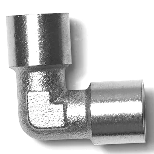 The Ascaso V..908 1/4F ELBOW is a metal pipe fitting with a 90-degree angle, rough-textured corner, and smooth cylindrical ends, shown against a white background. © 2025 1st-line.com