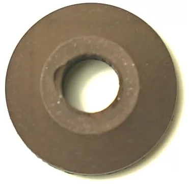 The F.1853 VITON CLOSING GASKET is a round, brown metal gasket with a large central hole and slightly beveled edges, shown from above on a light background. © 2025 1st-line.com