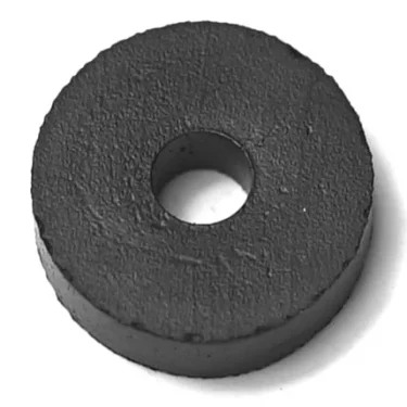 The R...36 VITON VALVE GASKET (14x4x5 mm), a round, flat black gasket with a central hole resembling a thick washer, is shown against a white background. © 2025 1st-line.com