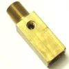The S...61 STEAM/WATER TAP BODY is a rectangular brass adapter with a threaded male end and a central side hole, shown on a white background. © 2025 1st-line.com