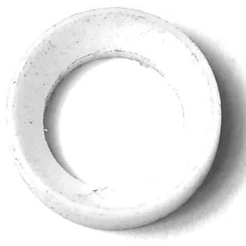 The SM.130 PTFE Gasket (14.5x10.5x4.5mm) is a white, circular washer with a hollow center, viewed from above, displaying minor surface imperfections and subtle shadows along the inner and outer edges. © 2025 1st-line.com