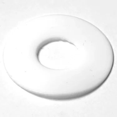 The SM.473 PTFE GASKET, a flat, circular white gasket with a central hole, is displayed on a plain white surface. © 2025 1st-line.com